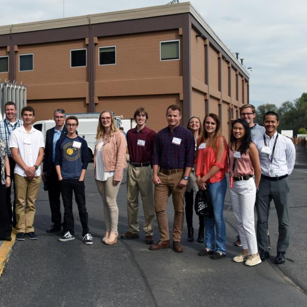 A group of students at the Fisher Manufacturing Center, Boulder, Colorado. Erik Stolz is center left, in white shirt.