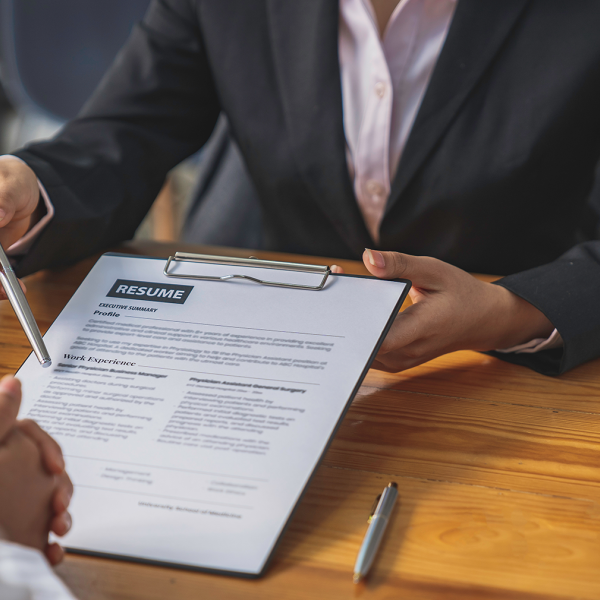Person holding a resume at an interview