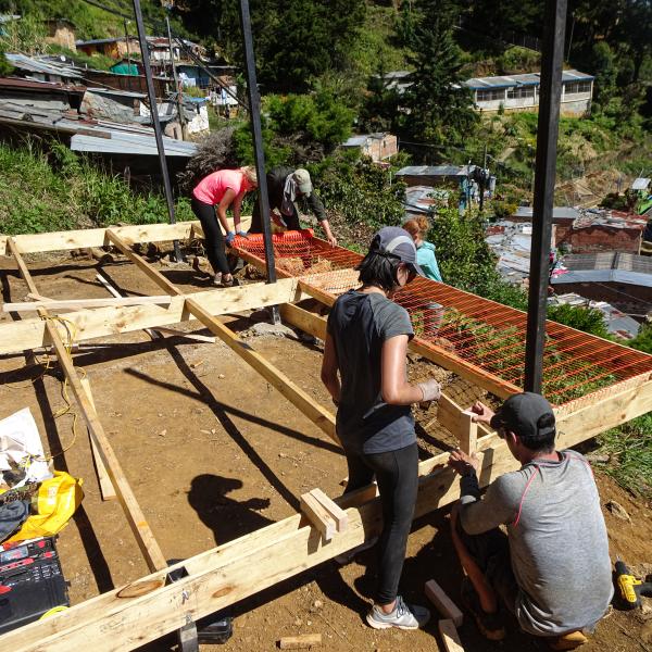 Students at a building site in Colombia