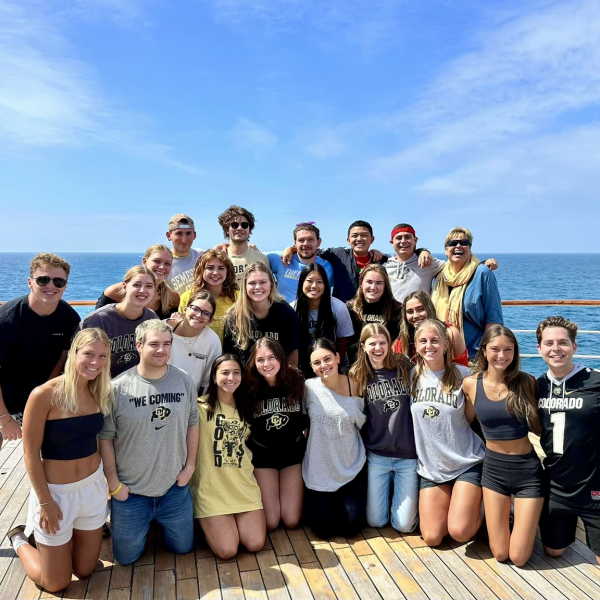 CU Students on ship deck wearing CU gear