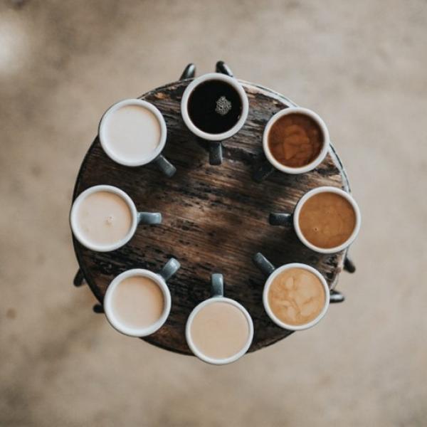 Circle of cups of coffee with all different shades
