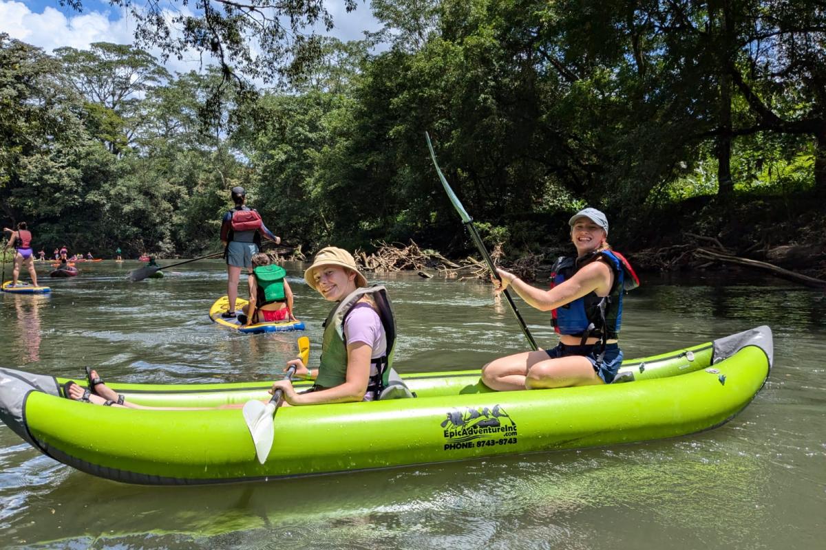 Students kayaking on a river