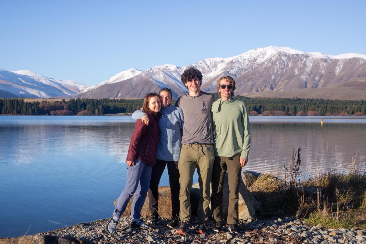 Students in front of lake and mountains in New Zealand