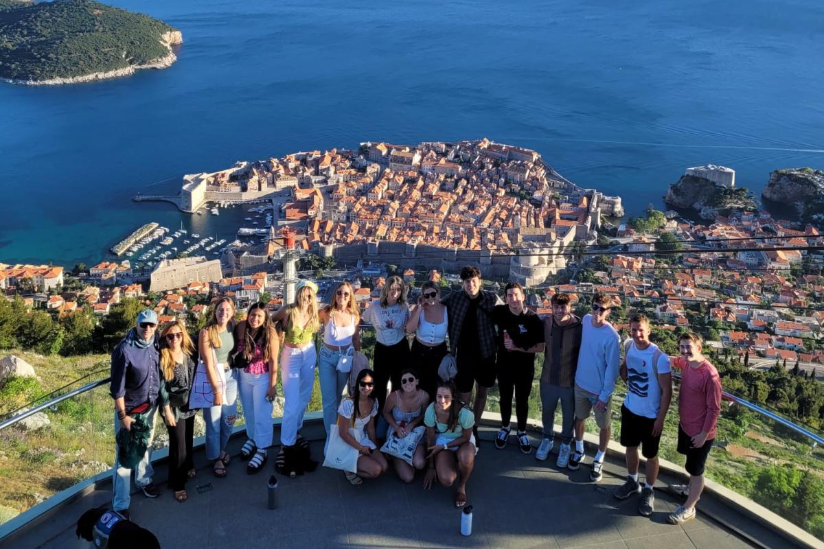Group of students with Zagreb, Croatia city and ocean in the background