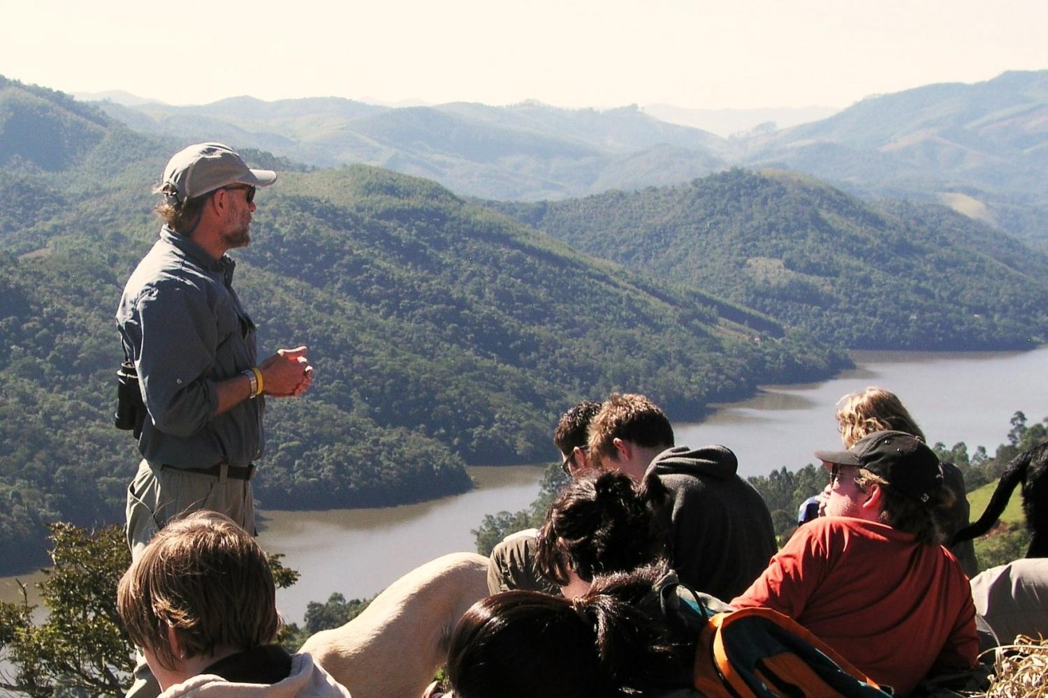 Teacher and students learning in the rainforest