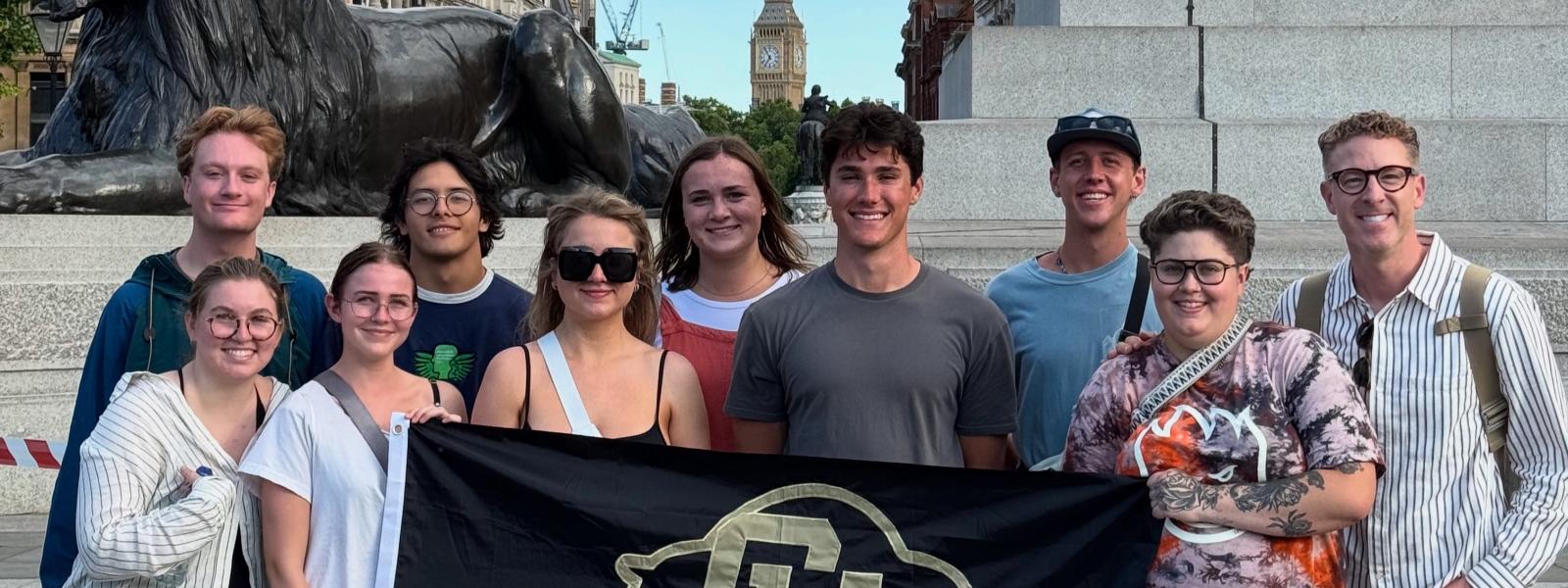Students with CU flag in Trafalgar Square