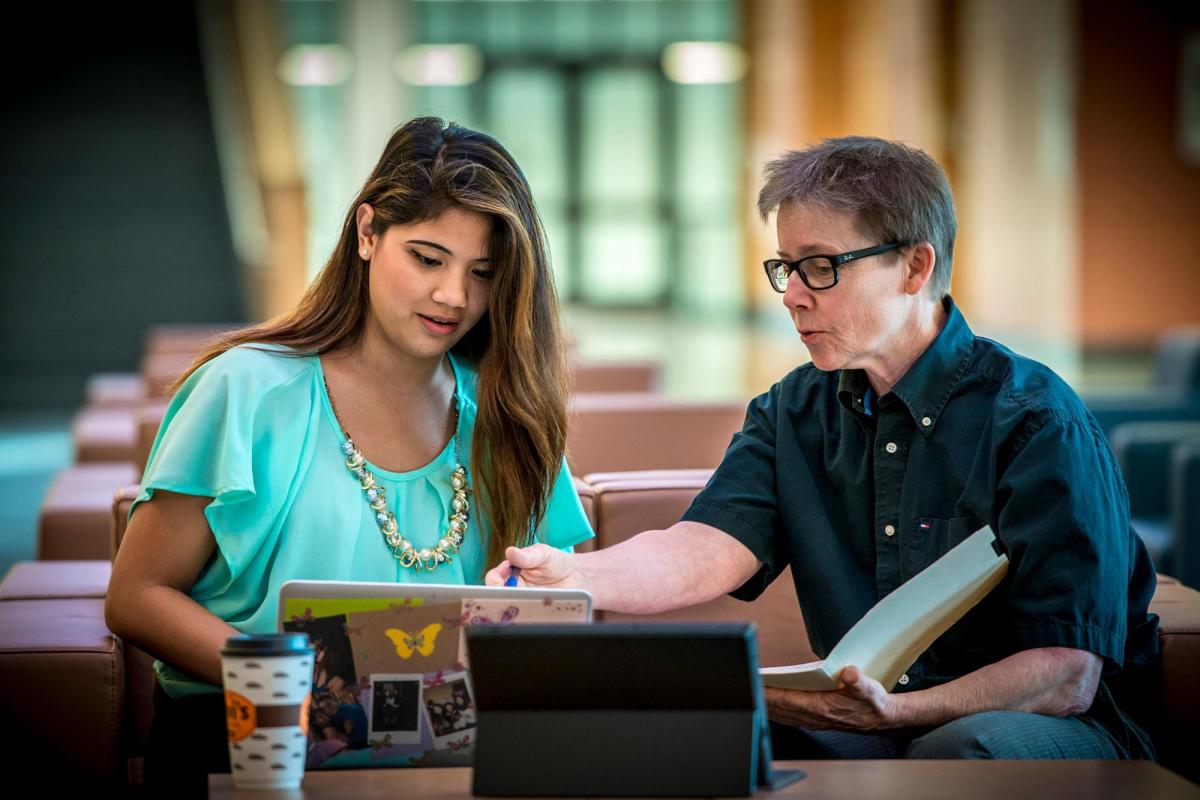 Advisor working with student