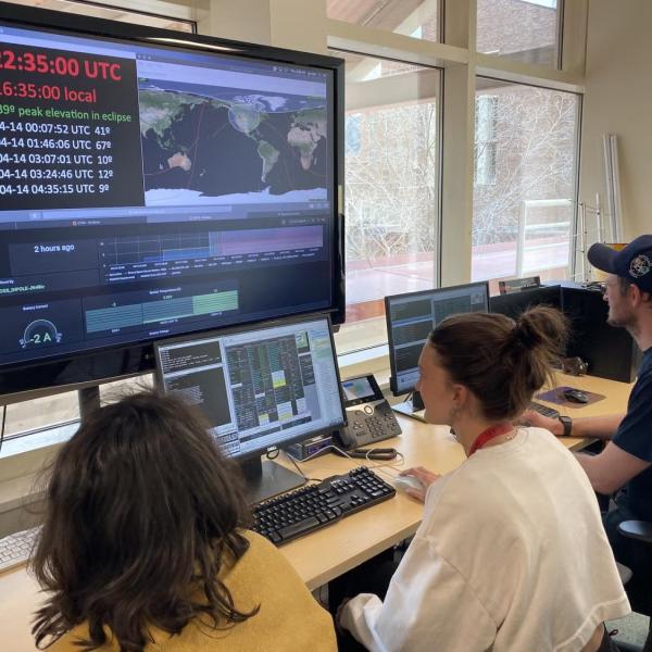 Members of the small satellites operation team at LASP monitor a spacecraft in orbit