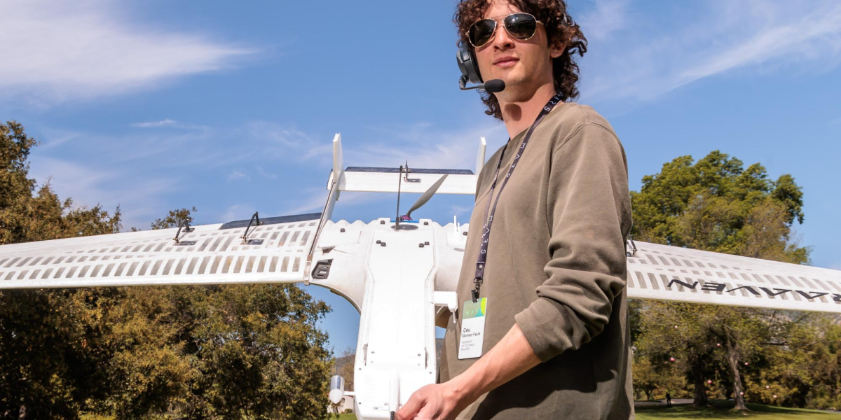 Céu Gómez-Faulk holding a RAAVEN drone.