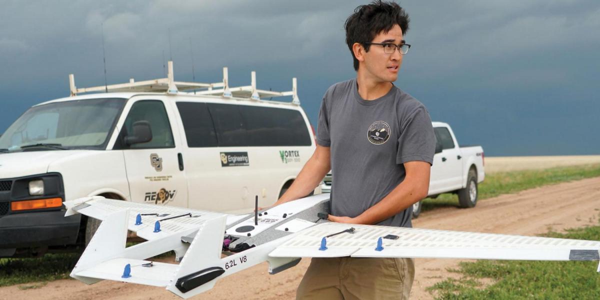 A student holding the RAAVEN drone.