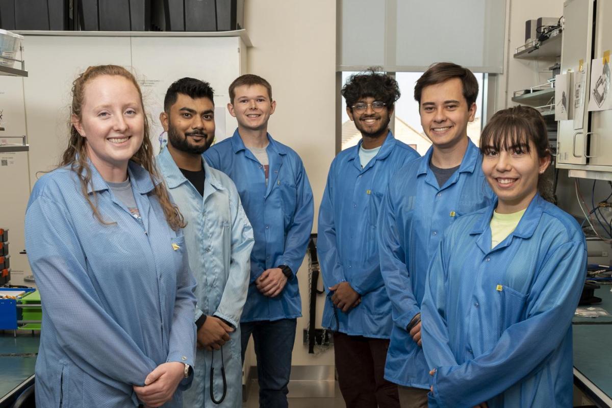 Group of students in the CubeSat lab.