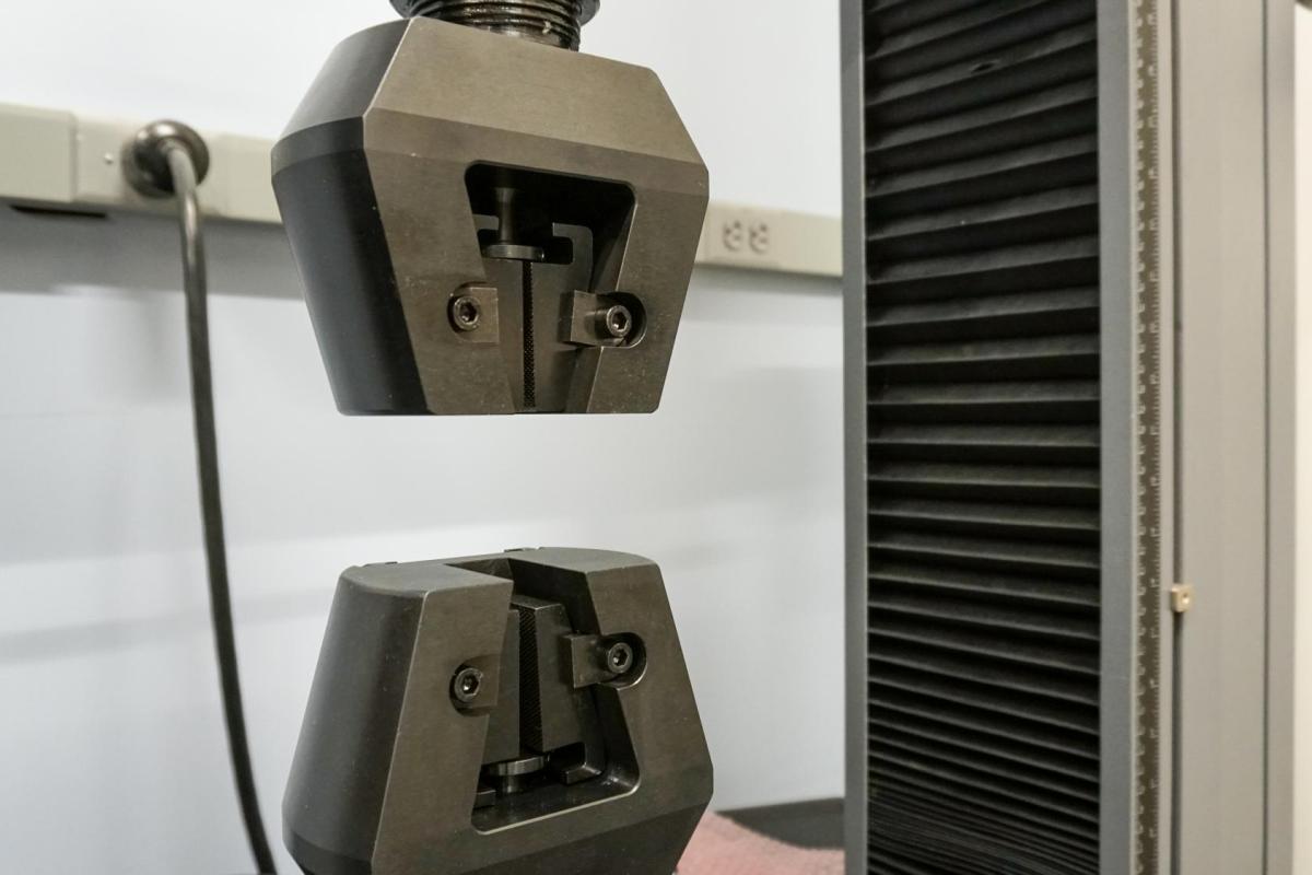Double stroke material compression tensile tester