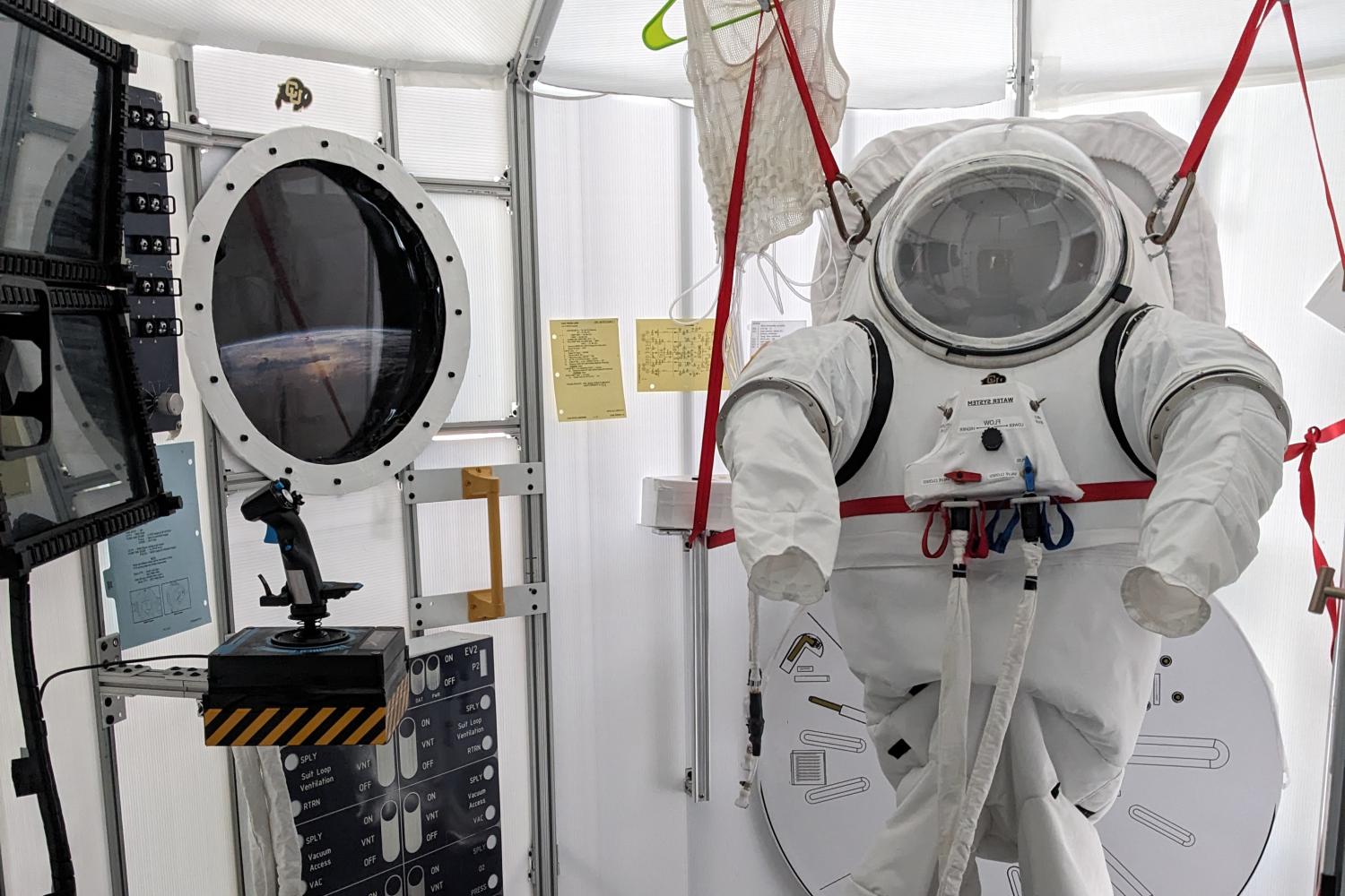 Spacesuit simulator and airlock in the Bioastronautics high bay in the Aerospace Building.