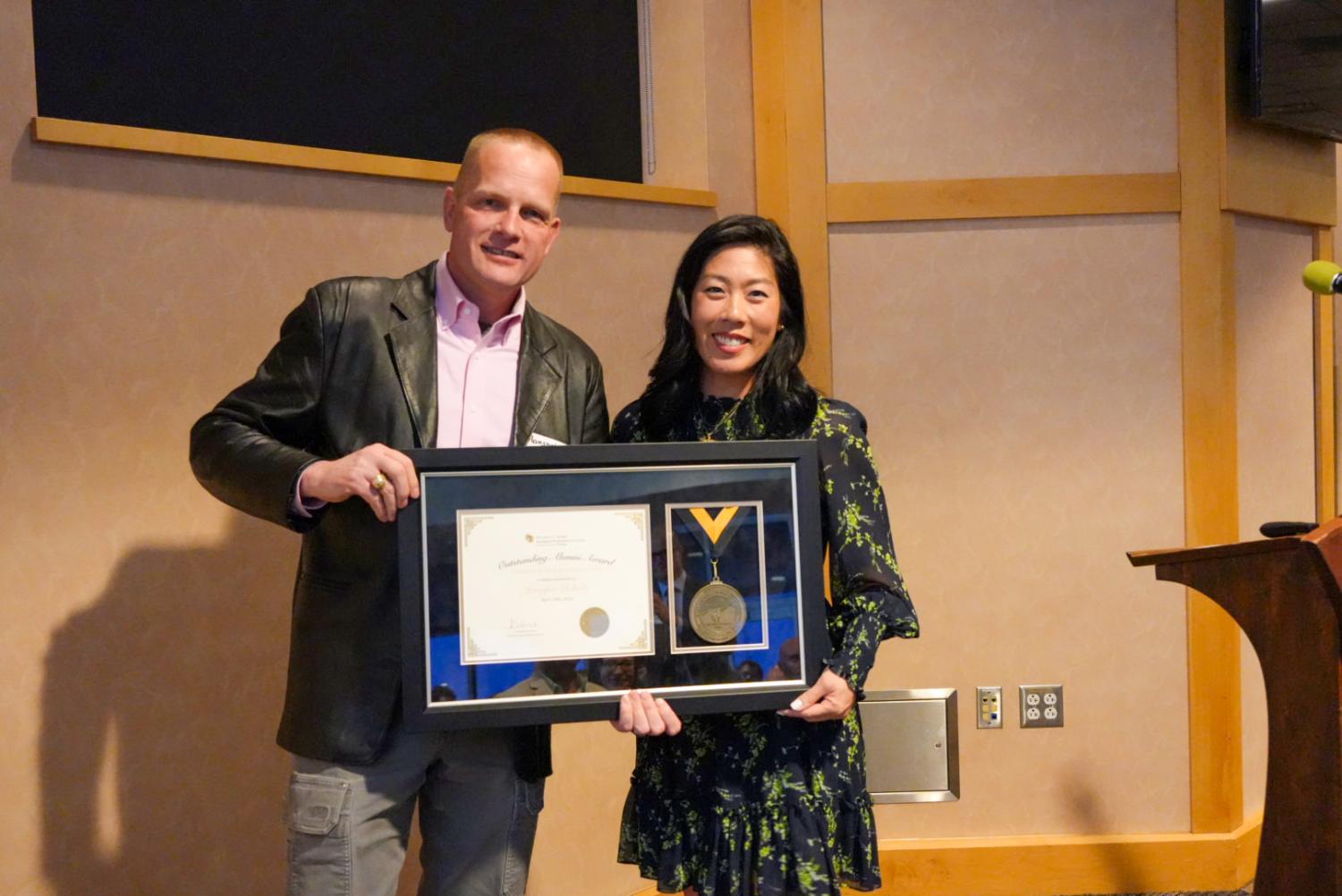 Hanspeter Schaub and Jen Uchida with her alumni award.