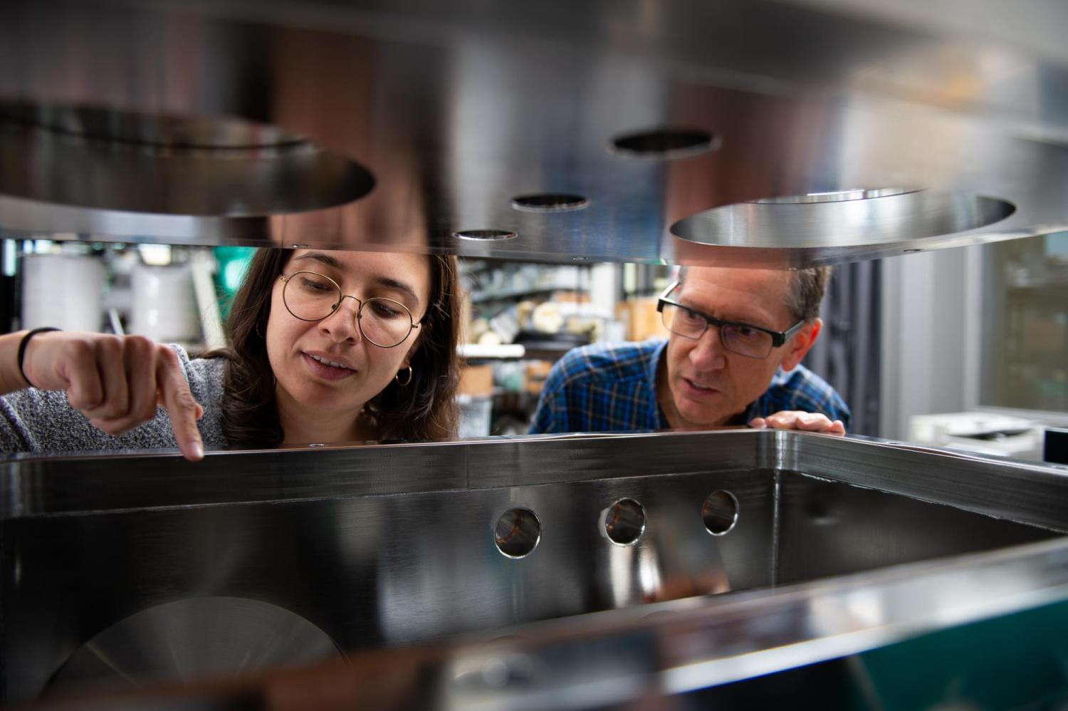 Professor Tim Minton and a student in the Molecular Beam Lab.