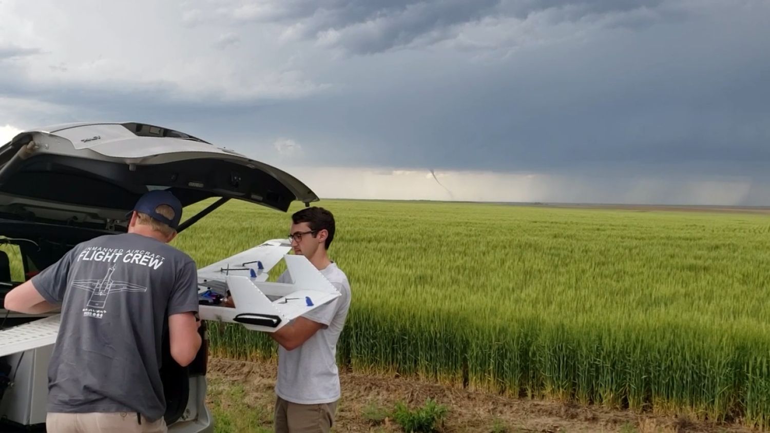 Preparing to fly a UAS with a tornado in the distance.