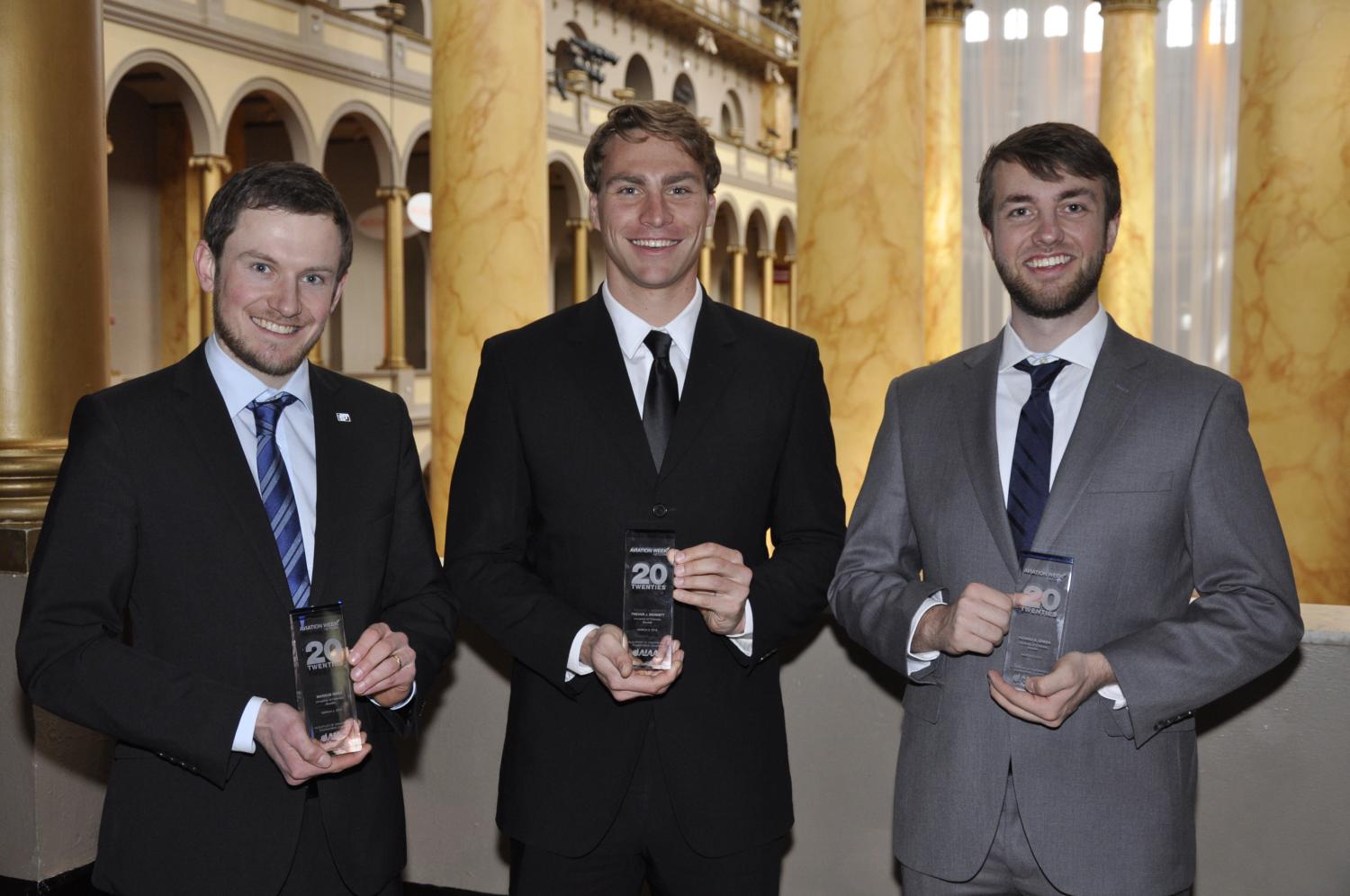 Markus Geiss, Trevor Bennett, and Thomas Green holding their awards.