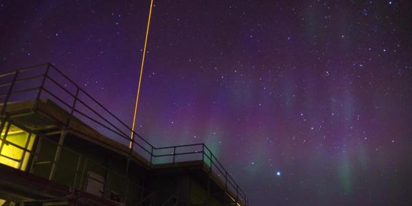  A lidar beam shooting into the night sky from Xinzhao Chu's lab in Antarctica.