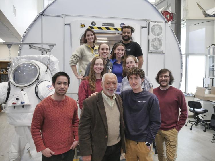 Charles Bolden with a group of bioastronautics students during a tour of the Aerospace Building.