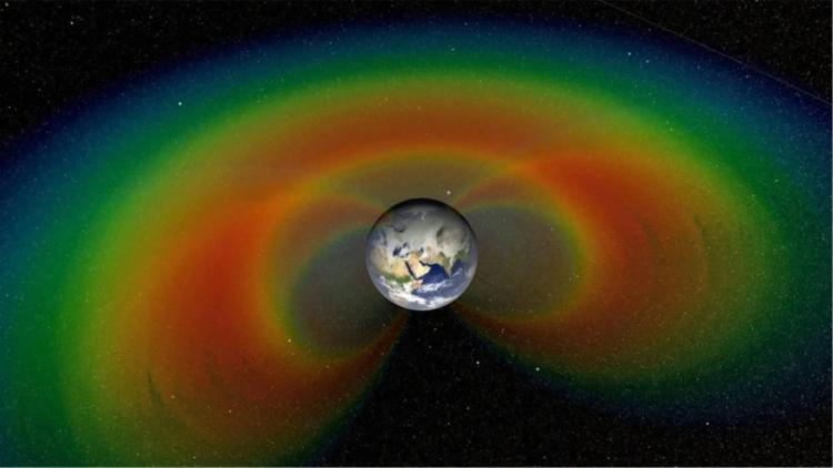 An artist’s concept of the Van Allen belts with a cutaway section of the giant donuts of radiation that surround Earth.