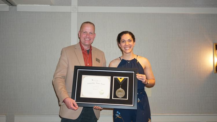 Hanspeter Schaub and Sarah Gillis with her alumni award.