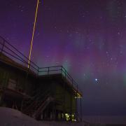 A lidar beam shooting into the sky at night.