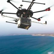 Drone flying over the ocean.