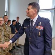 General Thompson shakes hand with Air Force ROTC cadet