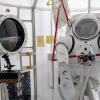 Spacesuit simulator and airlock in the Bioastronautics high bay in the Aerospace Building.