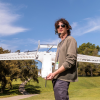 Céu Gómez-Faulk holding a RAAVEN drone.
