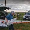 Preparing a RAAVEN drone for launch.