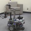 A test robot in a carpeted room.