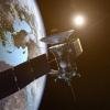 Rendering of a satellite orbiting the dark side of the Earth.