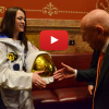 A student in a space suit meeting someone at the Capitol.