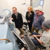 Dr. Paccione meets with aerospace engineering student in a wind tunnel lab during her campus visit Wednesday.
