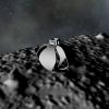 An artist's render shows a soft robot using its flexible flower-shaped limbs to touch down on an asteroid.