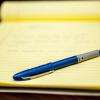 A pen and paper.