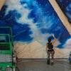 Trine Bumiller at work on her mural.