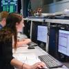 Students in the mission operations center at the Laboratory for Atmospheric and Space Physics in Colorado communicate with a satellite.