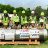 Members of the team with their digging machine at the competition.