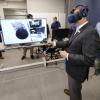 NASA Administrator Jim Bridenstine tries on a virtual reality headset during a tour of CU Boulder's new Aerospace Engineering Sciences Building. (Credit: Casey Cass/CU Boulder)