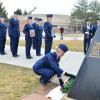 A cadet placing a wreath.