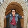 Becca Mikula in a covered wagon.