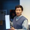 CU Boulder Professor Xinlin Li holds up a model of the CSSWE cube satellite that studied energetic particles in Earth's magnetosphere. The new CIRBE cube satellite will build on the success of the CSSWE. Photo: LASP