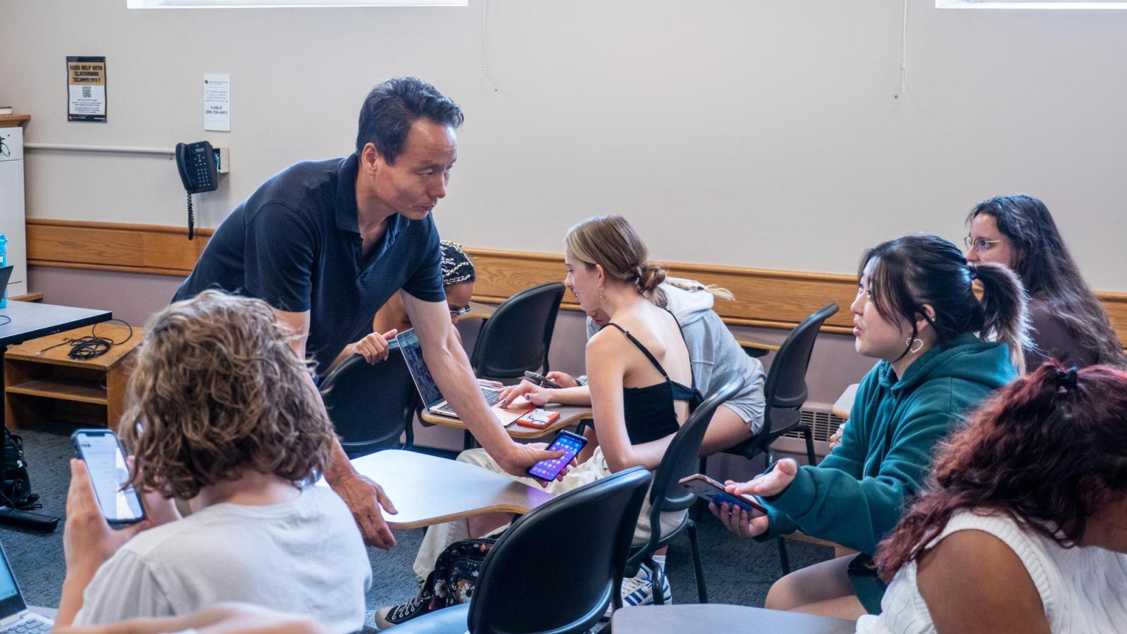 A male instructor talking to students