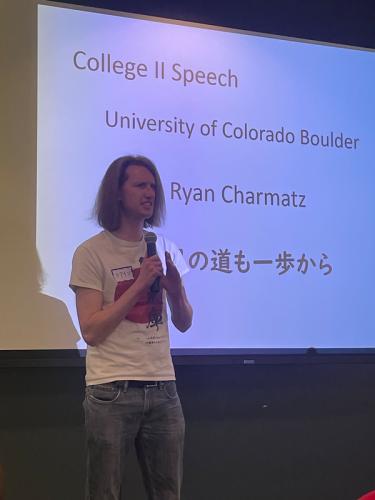 a male student giving a speech