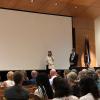 an instructor on the stage being awarded