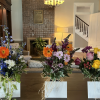 Three flower bouquets on a table