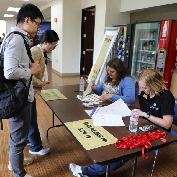 Students check in at sign-in table