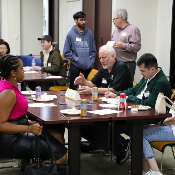 Group of people sitting in discussion